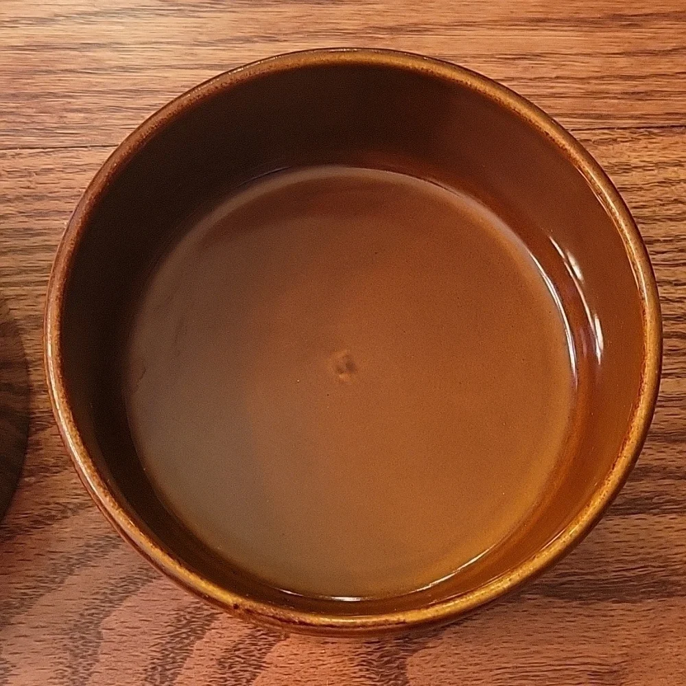 Two dark brown ceramic stoneware dog bowls.  5